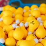 Yellow stress balls in the shape of lightbulbs